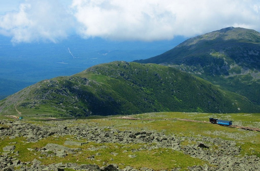 The Mount Washington Cog Railway takes you for a ride up the highest mountain in New England and through stunning mountain landscapes and nature.