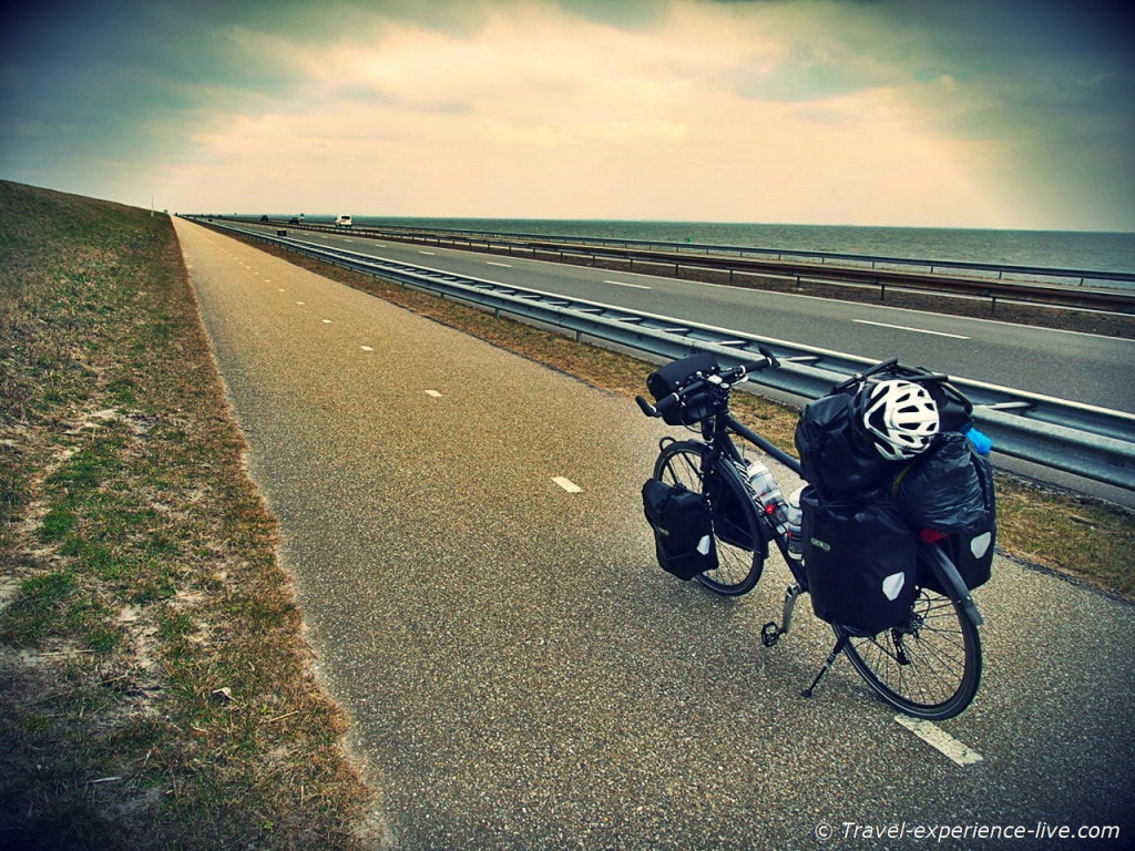 Cycling across the Enclosure Dam, Afsluitdijk, Netherlands.