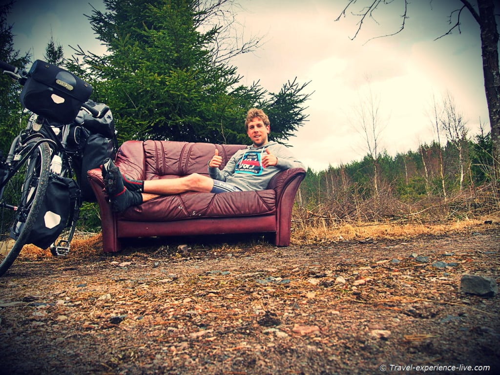 Resting on a couch in the woods in Sweden.
