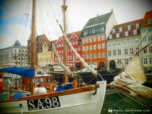 Sailboats and colored houses in Nyhavn, Copenhagen, Denmark