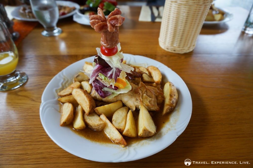 Slovenian Food: Pork, cheese, gravy and potato wedges