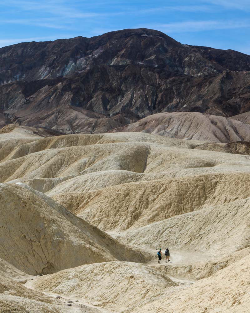 Hiker in the Zabriskie Point Badlands, Death Valley California
