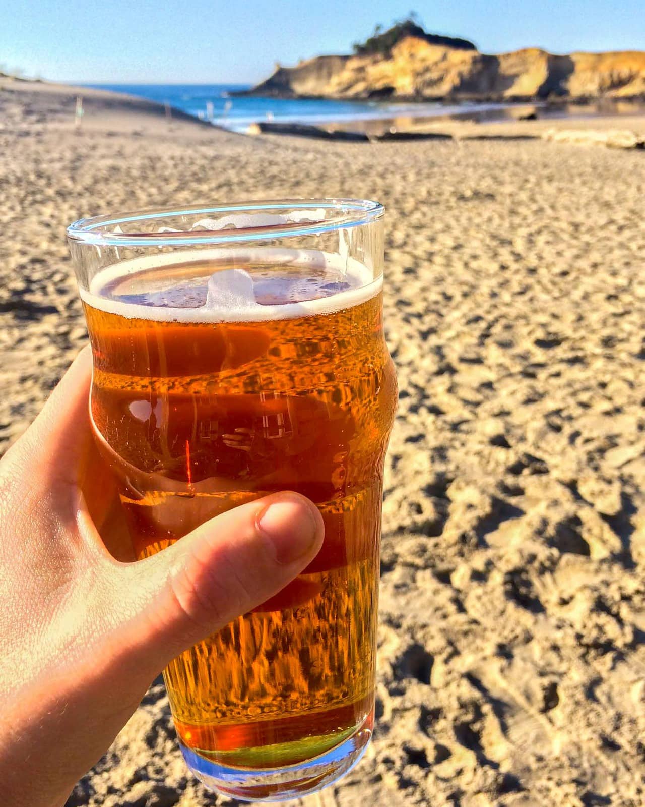 Pelican Brewing beer on the beach in Pacific City, Oregon Coast