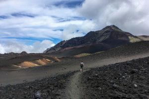 Hiker on Sliding Sands Trail in Haleakala Crater, Maui, Hawaii