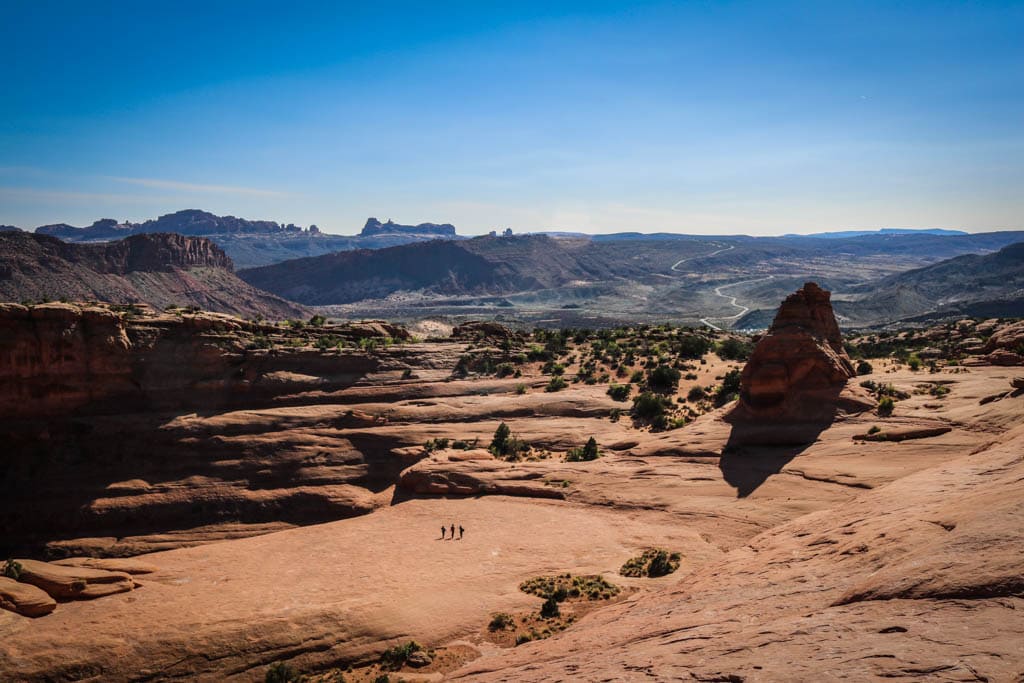 Three hikers in Arches National Park, Utah