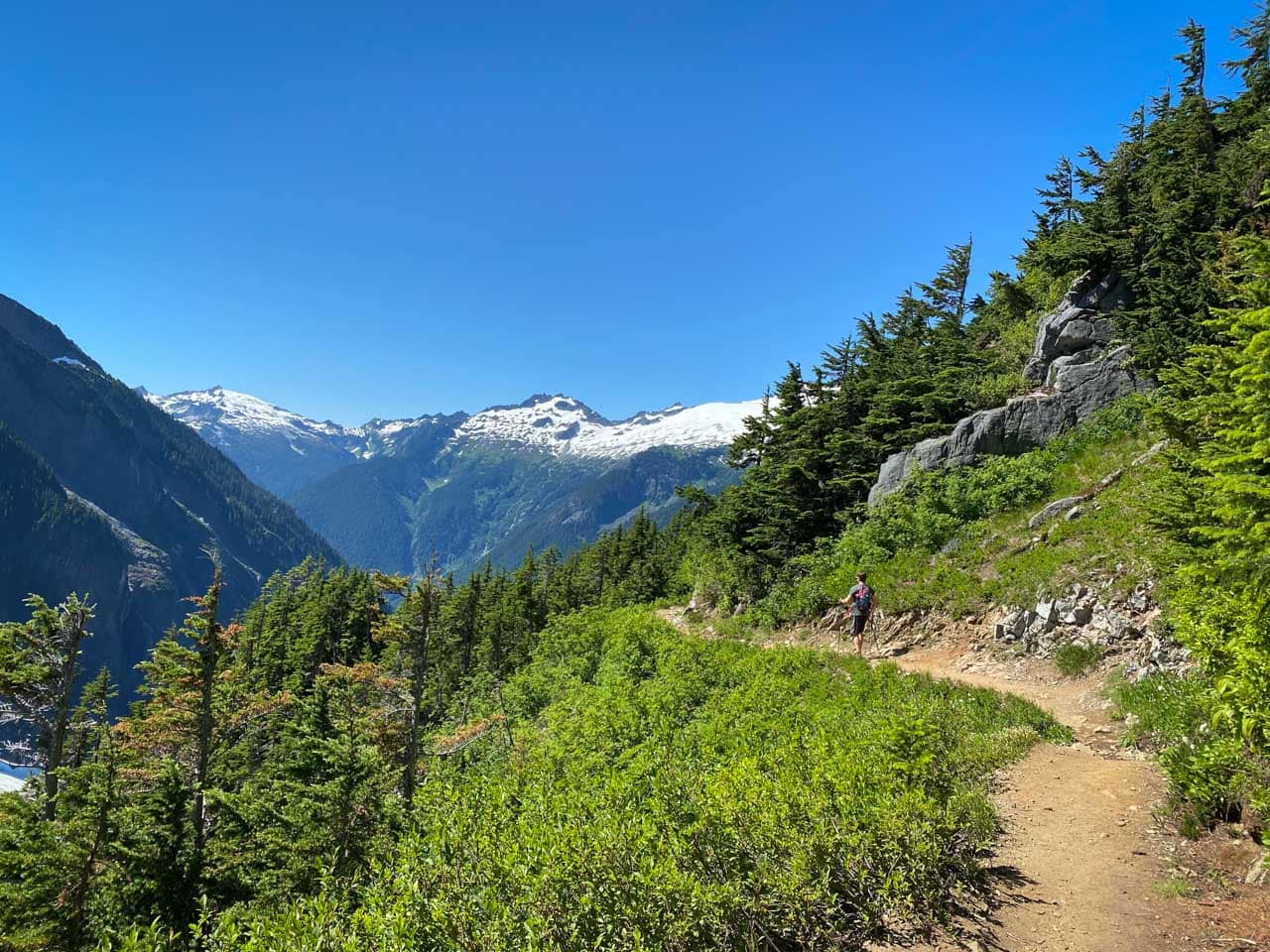 Cascade Pass hiker in North Cascades National Park, one of the less-crowded national parks to visit this summer