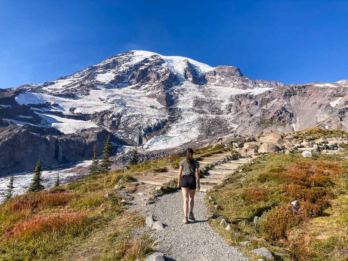 Hiker on a trail at Paradise, Mount Rainier, in fall