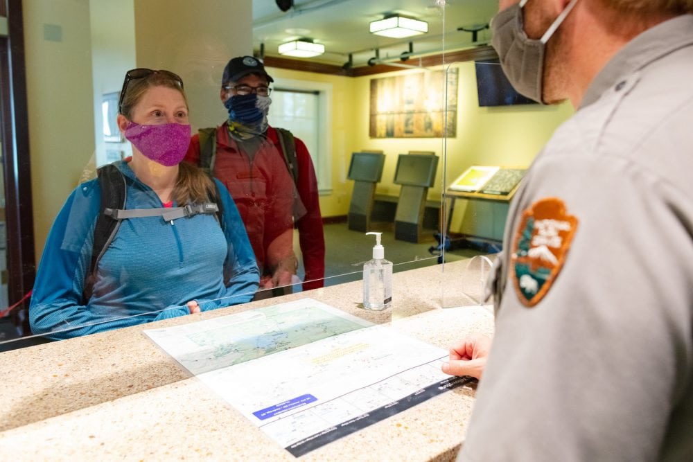Visitors and National Park Ranger Wearing Face Masks in Yellowstone - NPS Jacob W. Frank