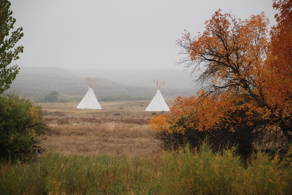 Tipis across Laramie River from Fort Laramie National Historic Site in Wyoming - Image credit NPS Mike Evans