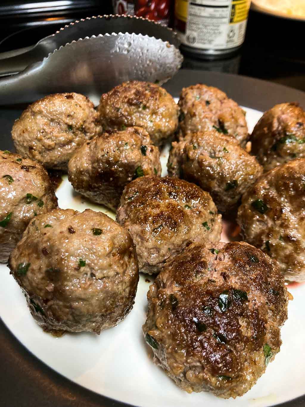 Bison meatballs with parsley cooked on a plate