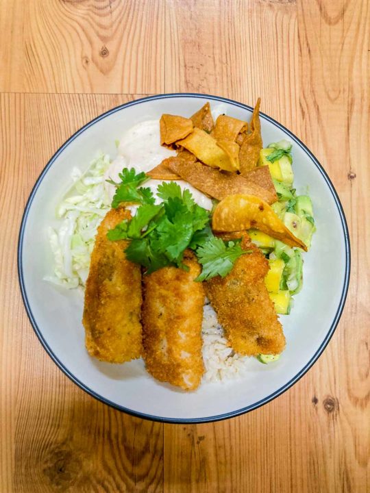 Fish taco bowls recipe with mango avocado salsa, spicy mayo and brown rice