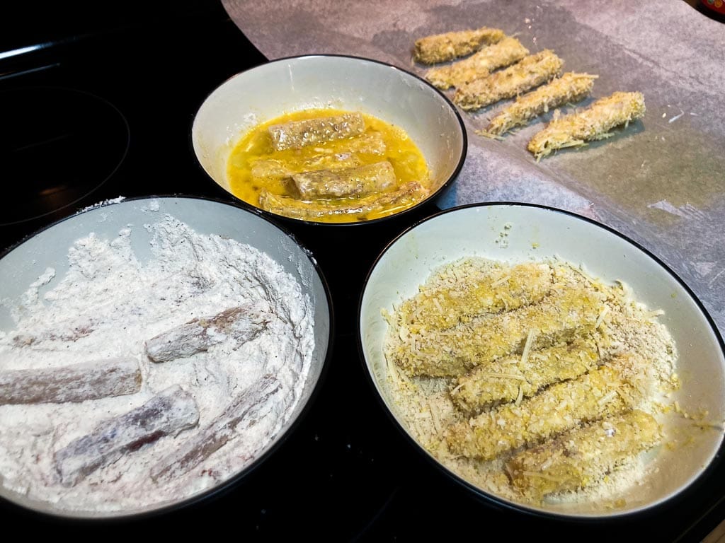 Preparing Kenai Fjords National Park-inspired cod sticks with flour, egg and panko breadcrumbs