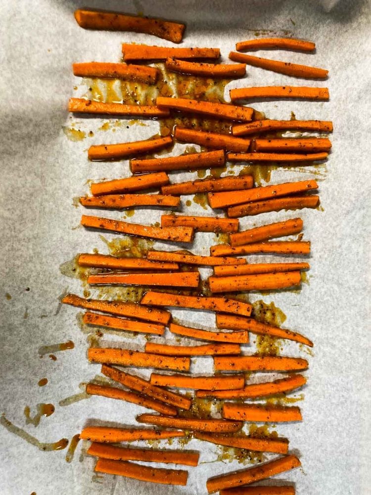 Carrot fries on baking sheet