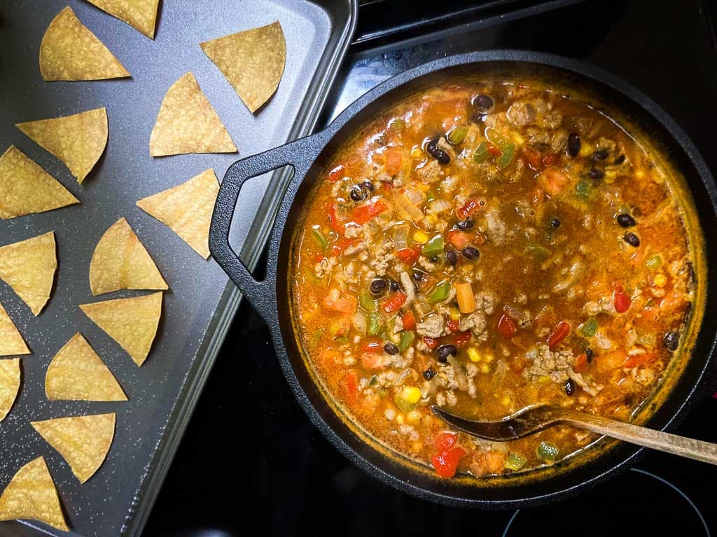 Ground turkey taco soup in pot with baked tortilla chips