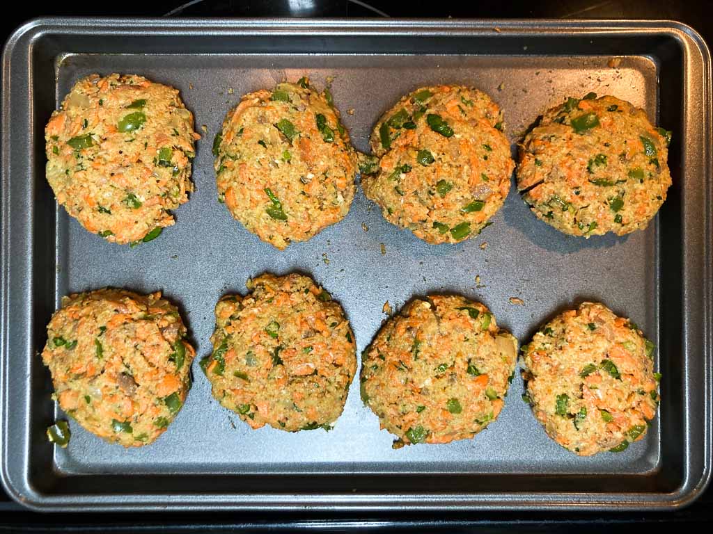 Salmon patties on baking sheet
