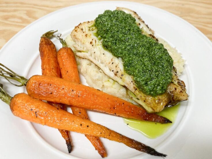 Pan-seared sablefish recipe with celery root puree, roasted baby carrots and carrot greens pesto