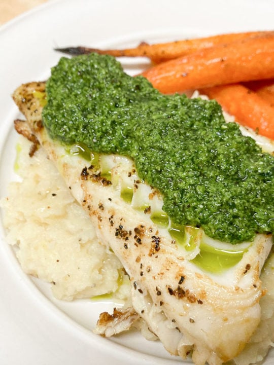 Pan-seared sablefish recipe with pureed celeriac, roasted baby carrots and carrot greens pesto