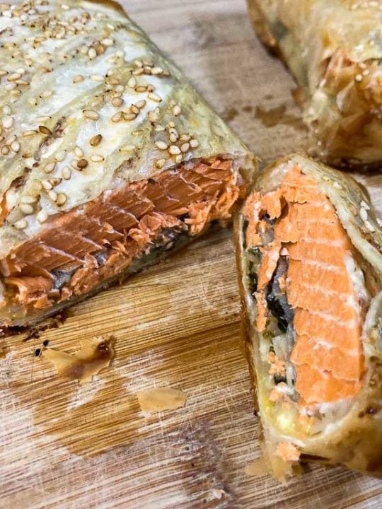 Wild salmon Wellington on cutting board