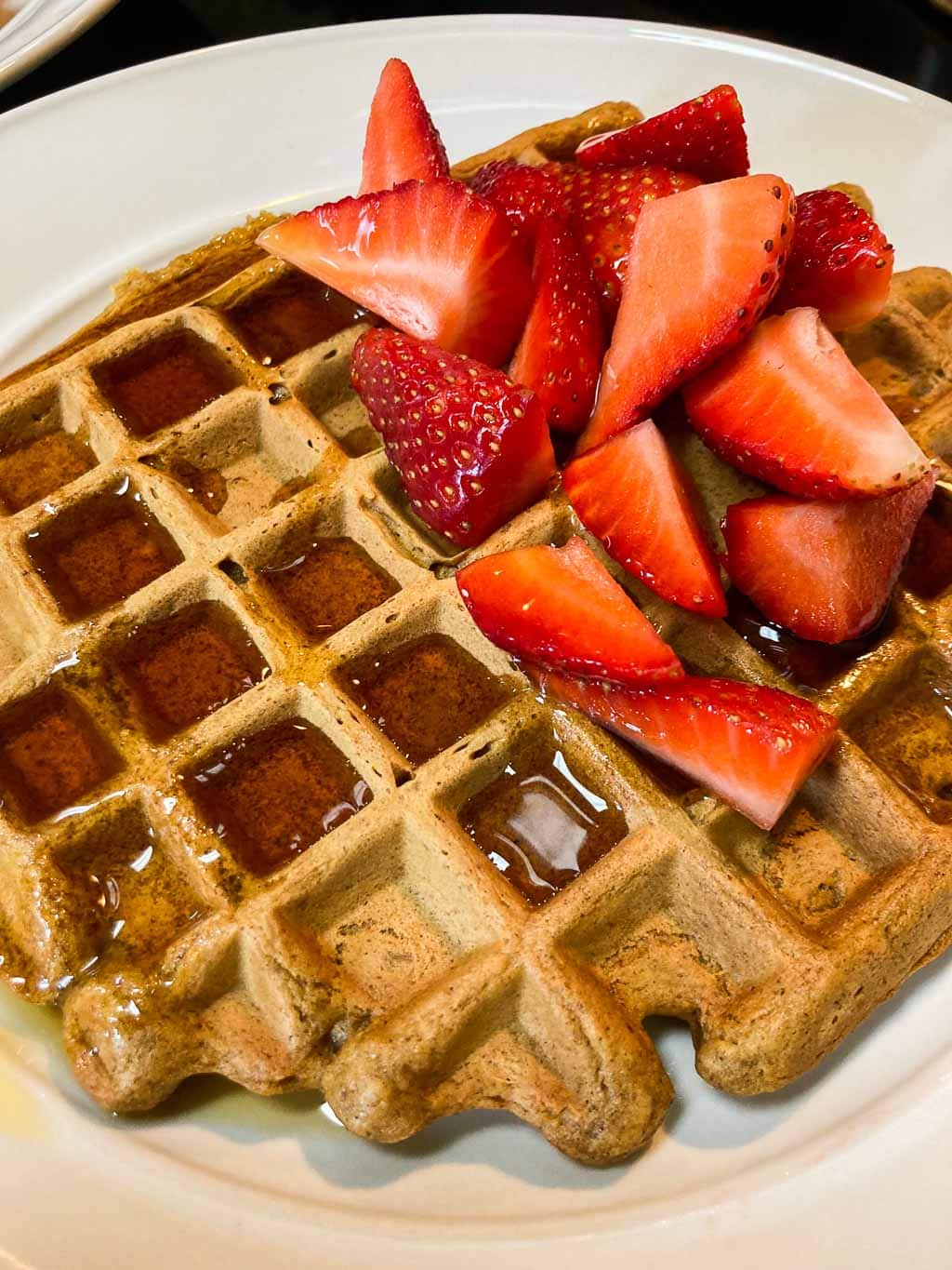 Pumpkin waffles recipe with strawberries and maple syrup
