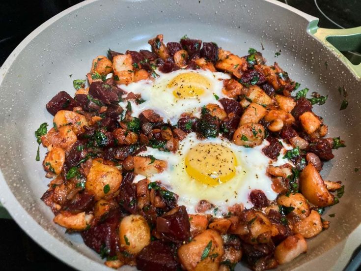 Red flannel hash recipe with potatoes, beets and fried eggs