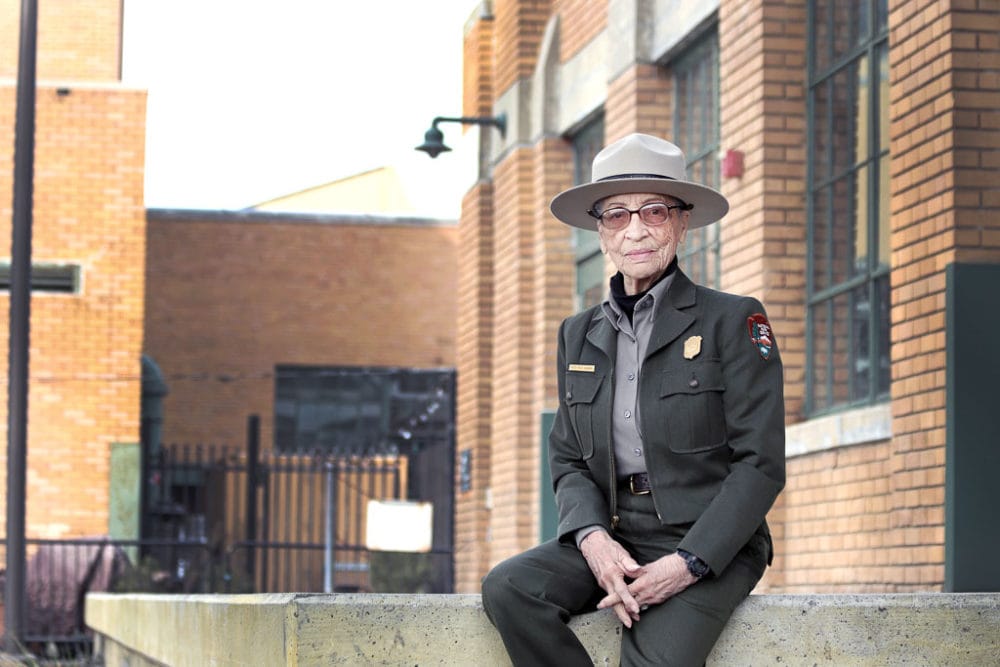 Ranger Betty Reid Soskin sits in front of the Rosie the Riveter Visitor Center Credit NPS Luther Bailey