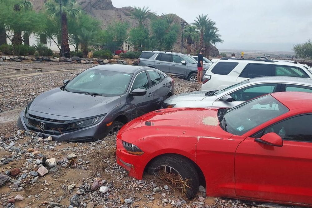 Debris from monsoonal rain immobilize sixty cars belonging to visitors and park staff in Death Valley National Park at the Inn at Death Valley - Photo Credit NPS