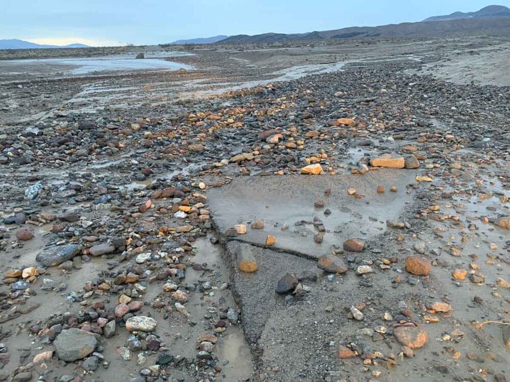 Water and rocks flow over damaged North Highway in Death Valley National Park - Photo Credit NPS