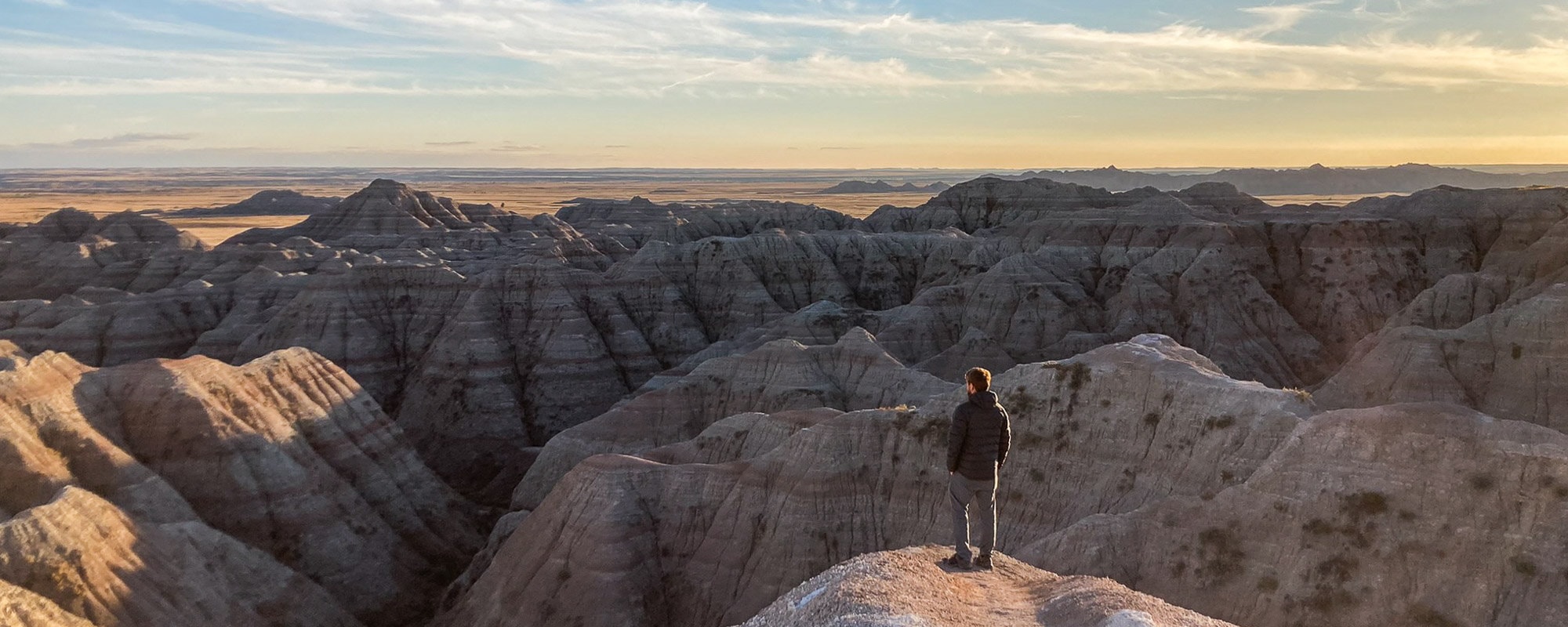 White River Valley Overlook at sunset with visitor, Badlands National Park in South Dakota