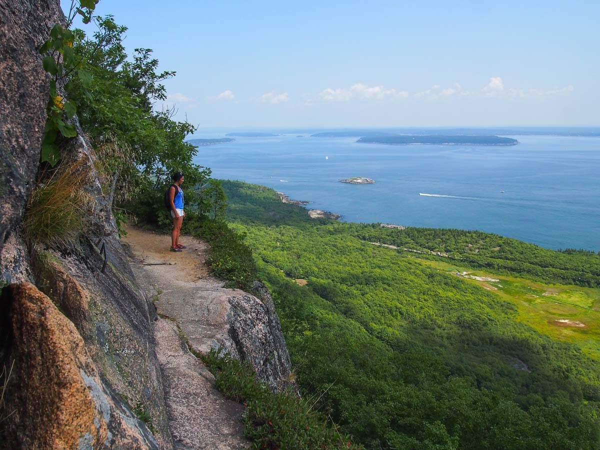 Hiker enjoys the views from the Precipice Trail in Acadia National Park