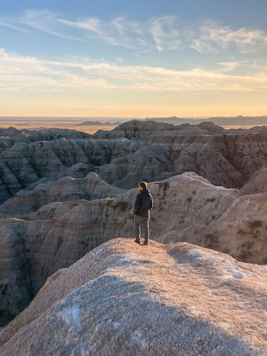 White River Valley Overlook at sunset with visitor in Badlands National Park, South Dakota