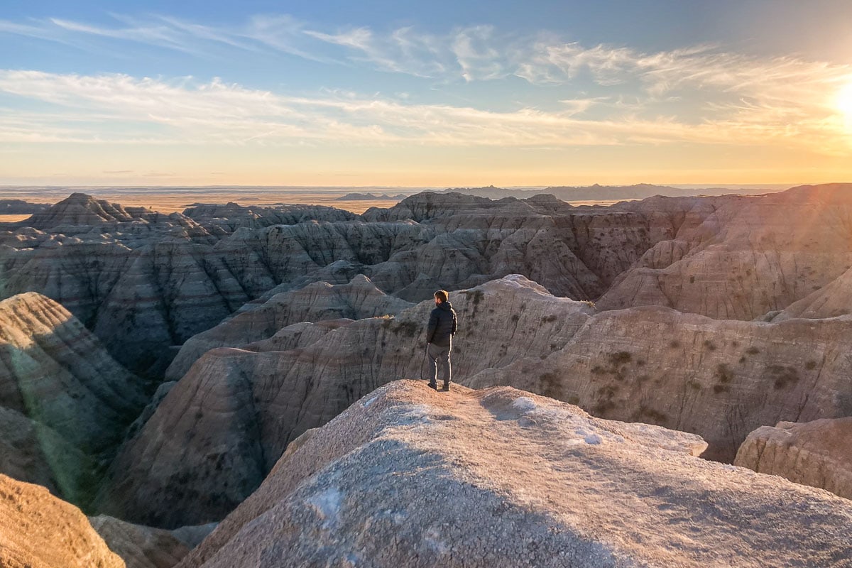 White River Valley Overlook at sunset with visitor in Badlands National Park, South Dakota