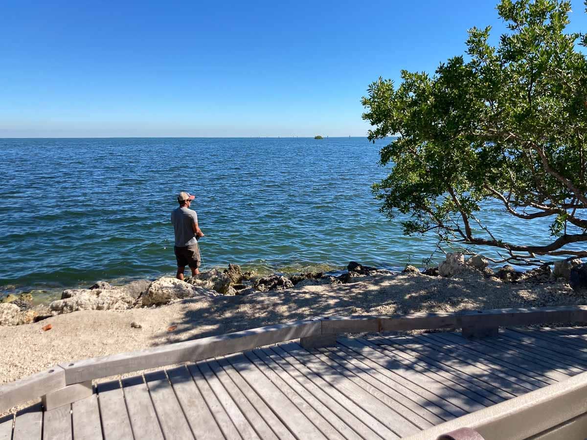 Man fishing in Biscayne Bay at Dante Fascell Visitor Center in Biscayne National Park, Florida