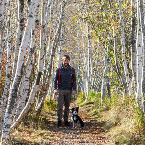 The National Parks Experience founder Bram Reusen with his dog in Acadia National Park
