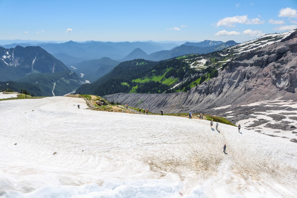 People exploring the snow-covered meadows of Paradise, Mount Rainier National Park