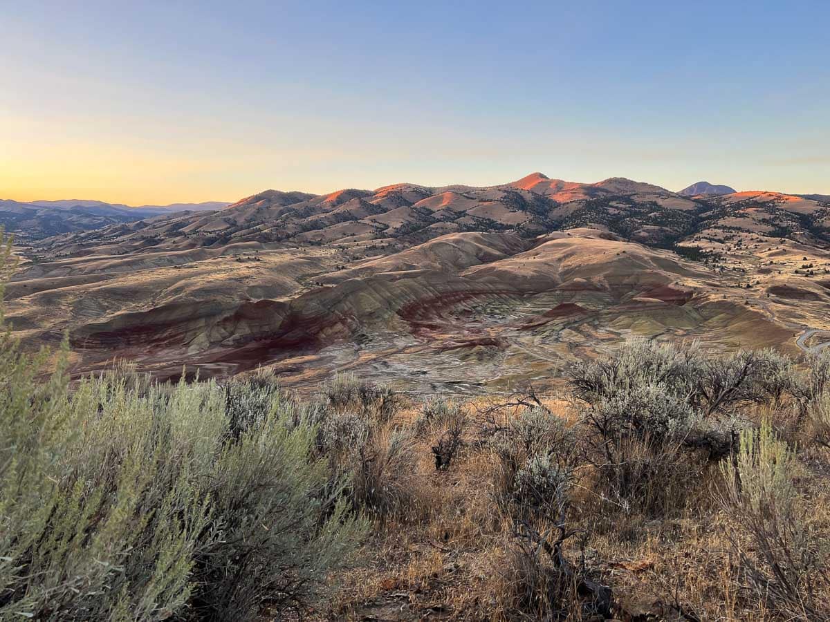 Carroll Rim Trail sunrise view of the Painted Hills of John Day Fossil Beds National Monument