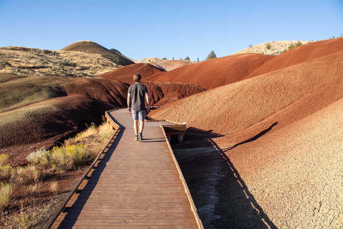 Hiker on Painted Cove Trail at Painted Hills Unit, John Day Fossil Beds National Monument
