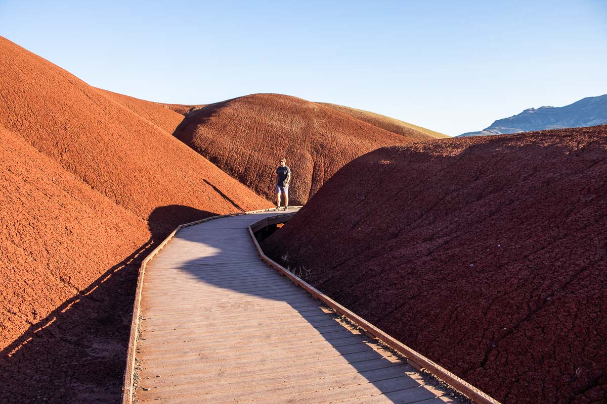 Hiker on the Painted Cove Trail at Painted Hills Unit, John Day Fossil Beds National Monument, Oregon