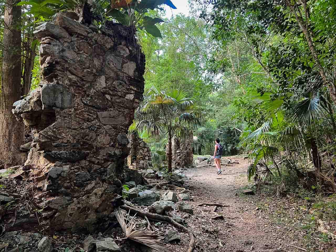 Hiker at historic sugar mill ruins Hiker on the Reef Bay Trail, Virgin Islands National Park